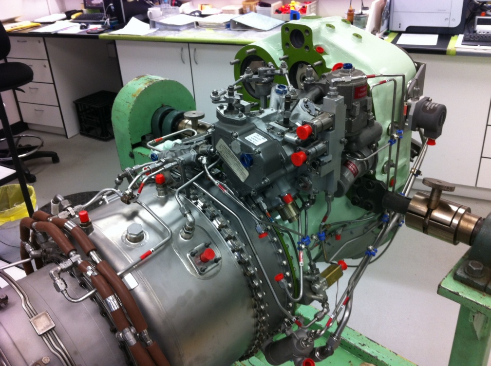 A TPE-331 GAS TURBINE SHOWING THE WOODWARD 2228 SERIES FUEL CONTROL ON TOP OF THE ENGINE.