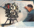 A Woodward jet engine fuel control cutaway on display.