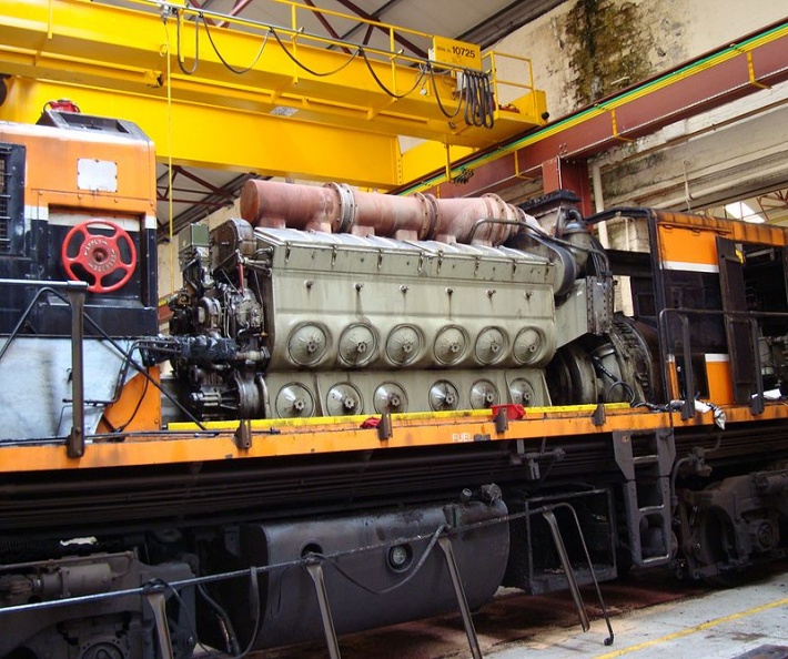 An EMD diesel engine showing the Woodward PG Rail governor(dark green unit on the left of the engine).