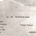 The front of an early A.W. Woodward business card.
