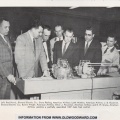 Laymen looking at Woodward's newest state-of-the-art jet engine fuel control, circa June 1960.