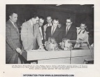 Laymen looking at Woodward's newest state-of-the-art jet engine fuel control, circa June 1960.