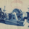 Factory photo of a Woodward compensating type governor connected to a Pelton Water Wheel system.