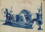 Factory photo of a Woodward compensating type governor connected to a Pelton Water Wheel system.