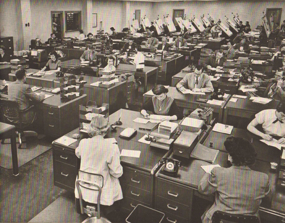 The main office area before the cubical wall partition was invented..