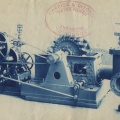 Factory photo of a Woodward Water Wheel Governor and a Pelton Turbine.