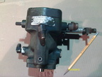 A black Woodward SG type hydraulic engine governor.