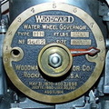 A Woodward gate shaft opening positioning dial in the collection.