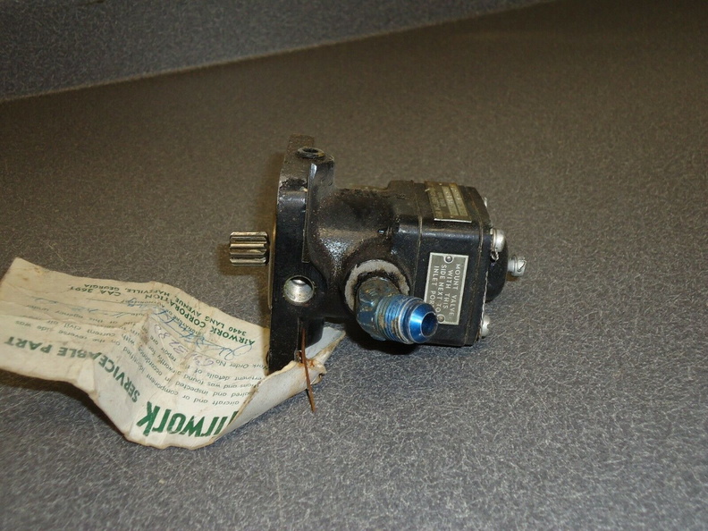 A LEAR SMALL JET ENGINE FUEL PUMP.