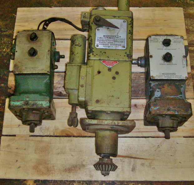 Three vintage Woodward diesel engine governors made in Rockford, Illinois.