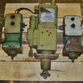 Three vintage Woodward diesel engine governors made in Rockford, Illinois.