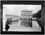 Plant at Dam #5, circa 1930. FOREBAY (WEST) ELEVATION. NOTE ABSENCE OF MONITORS. (Courtesy of the Potomac Edison Company Library (Hagerstown, MD), Historical Data Files, HAER WVA,2-HEDVI.V,1-37.tif