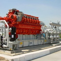 A diesel engine connected to a gas compressor.