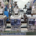 Three Zexel small engine governors similar to a Woodward SG governor.