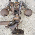 A worn out steam engine governor.