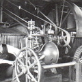 Elmer Woodward installing his patented compensating type turbine water wheel governor.