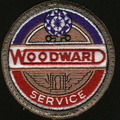 Woodward Governor Company's 25 year service emblem worn on the shop coat of thier workers. 