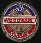 Woodward Governor Company's 25 year service emblem worn on the shop coat of thier workers. 