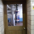 Looking out from the brewhouse into the engine room working at the Stevens Point Brewery.