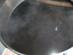 Sparging the mash in the lauter-tun kettle, running off the wort into the brew kettle.