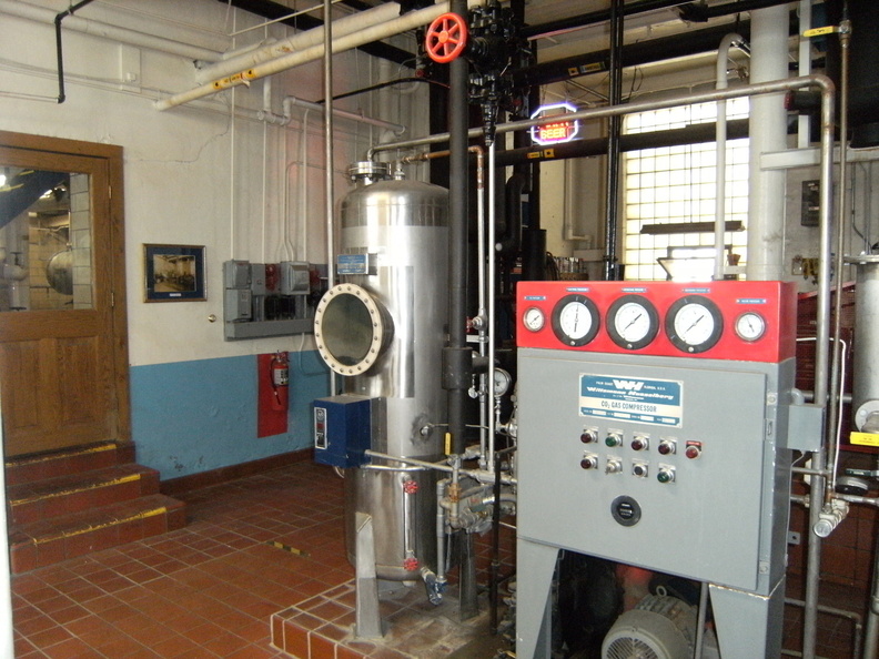 In the engine room with the door to the brew house on the left.