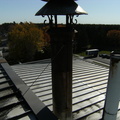 Brewer Brad on top of the Brewery next to the brew kettle steam stack..JPG