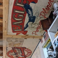 Old beer signs made into brewery garage shelving upcycled into ceiling art in the man cave.