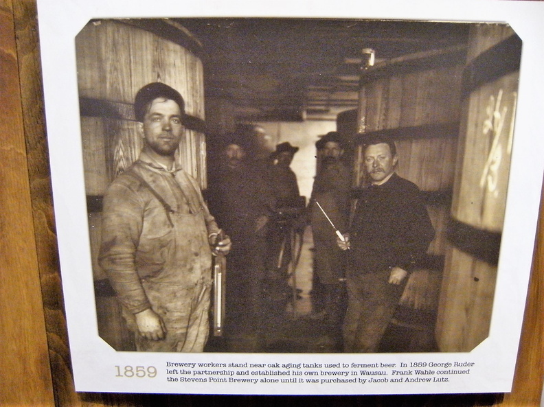 The Stevens Point Brewery workers in the stock celler testing the beer wort gravity