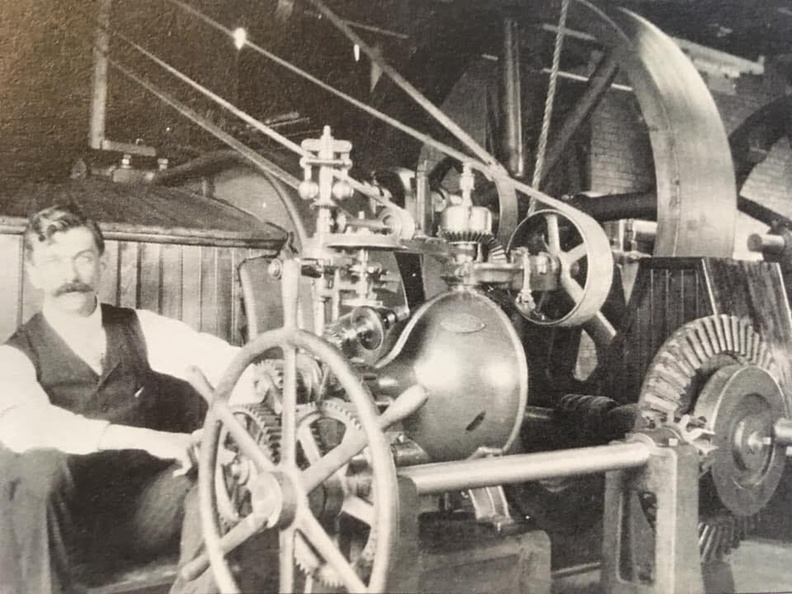 Elmer E. Woodward and his compensating type water wheel governor contraption.