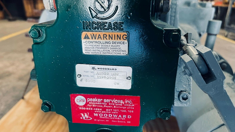 The Woodward TG13 series governor name plate on the steam turbine.