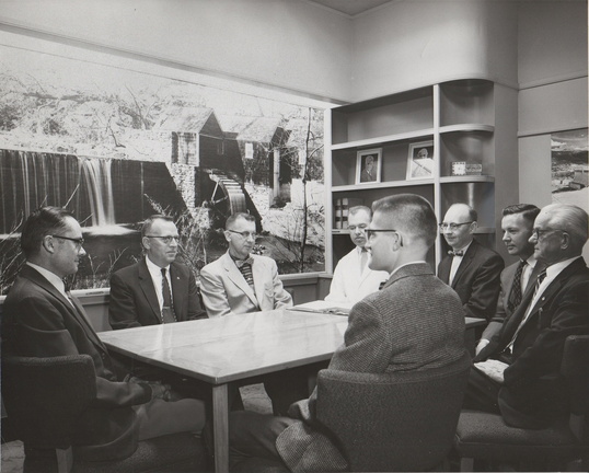 Woodward members discuss business in the main conference room on June 14, 1958.