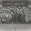 A picture of Woodward worker members on the Woodward Governor Company's front steps.