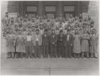 A picture of Woodward worker members on the Woodward Governor Company's front steps.