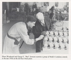 Elmer and George looking over propeller engine governors ready for shipment.