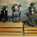 Two Woodward aircraft engine governors and a Hamilton Standard governor in the middle(made by Woodward).