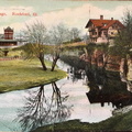 A postcard of the Tinker Swiss Cottage showing the Railroad Depot across Kent Creek.