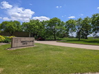 The original Woodward visitors entrance looking toward the mill pond over the mound.