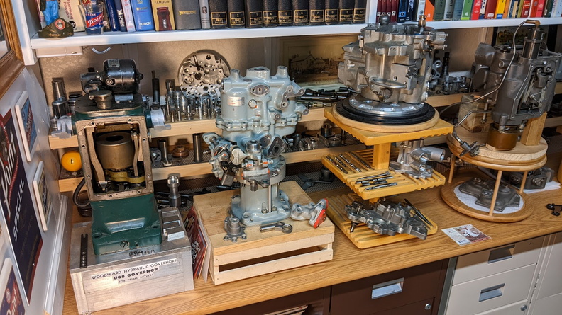 A Woodward UG-8 diesel engine governor next to a Lucas jet engine governor next to a Woodward GE T700 series jet engine control.