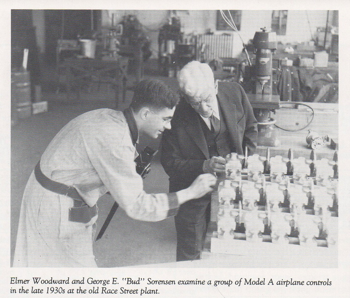 Inspecting a group of Hamilton Standard Model A airplane controls ready for shipment.