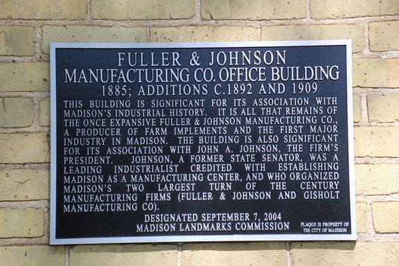 A history plaque on the Fuller & Johnson Manufacturing Company's Office Building in Madison, Wisconsin.