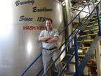 Brewer Brad in the office behind the 6000 gallon (200 barrel) MDV Mash Kettel in the Stevens Point Brewery.