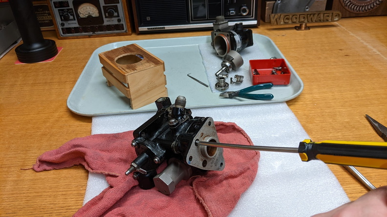 Removing the four screws to the lower unit with the oil pump parts.