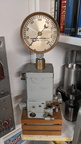 A whimsical display of a Woodward EG actuator unit with a 1921 Woodward governor oil pressure gauge