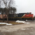 A CN train waiting to enter the main yard one mile down the tracks.