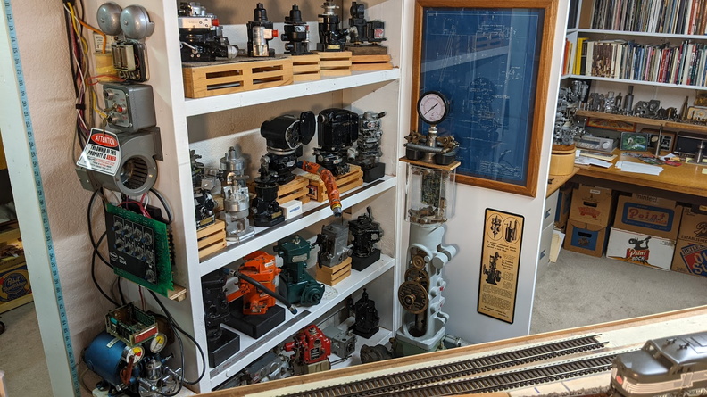 The Hamilton Standard Corsair aircraft engine governor (dark gray unit) is on the end of the third shelf. A Hamilton Standard (Woodward) governor for the F4U Corsair airplane engines..jpg