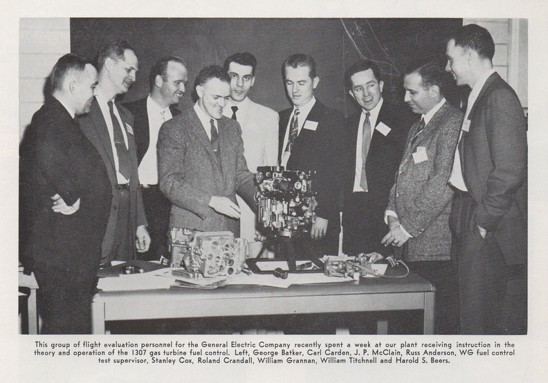 A group layman of  looking over the Woodward jet engine fuel control governor system..jpg