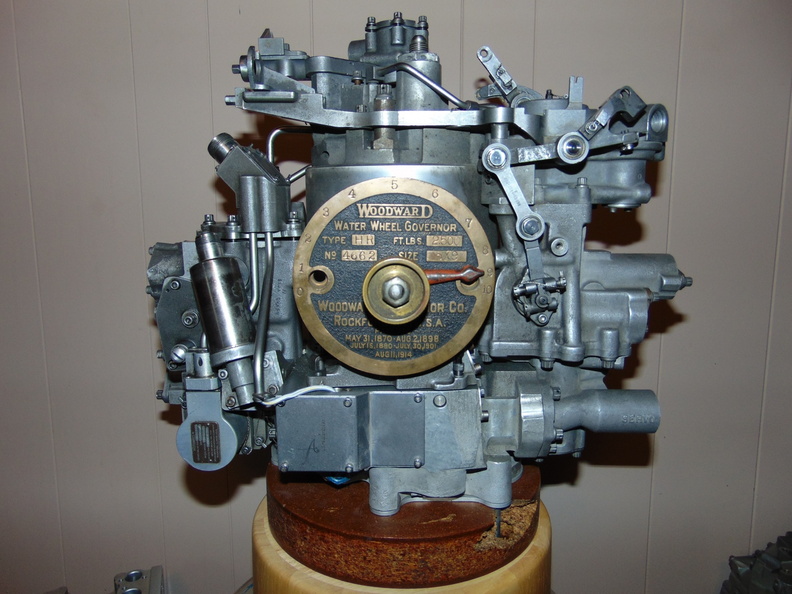 Brad's whimsical Woodward jet engine fuel control governor with a turbine water wheel governor gate limit dial from 1921..jpg