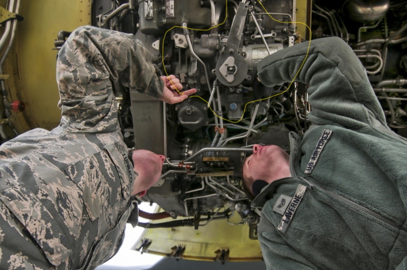 Looking up at a CFM56 -3 jet engine showing the Woodward fuel control governor system.