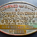 A Woodward Brass Rotary Pump Name Plate.