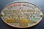 A Woodward Brass Rotary Pump Name Plate.